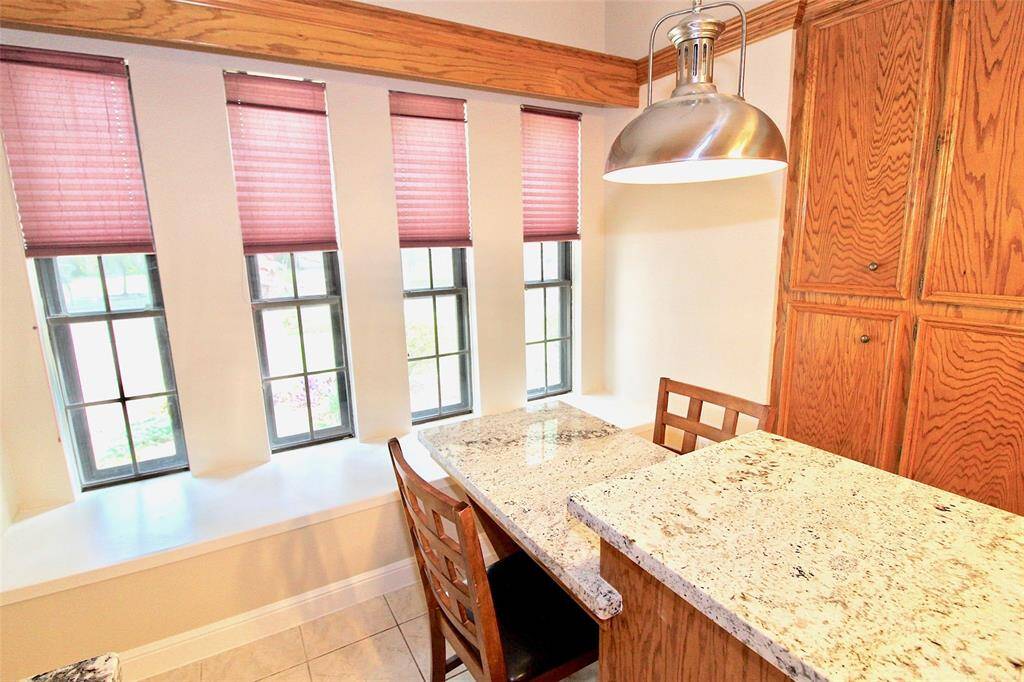 Close up view of the custom made breakfast table with granite countertops.