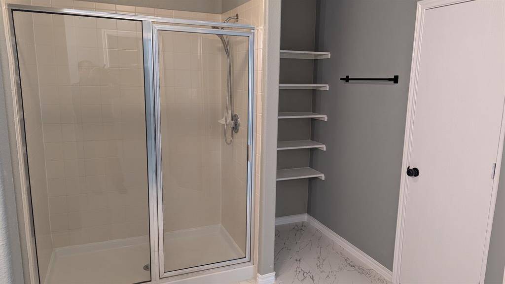 stand-in shower in master bathroom