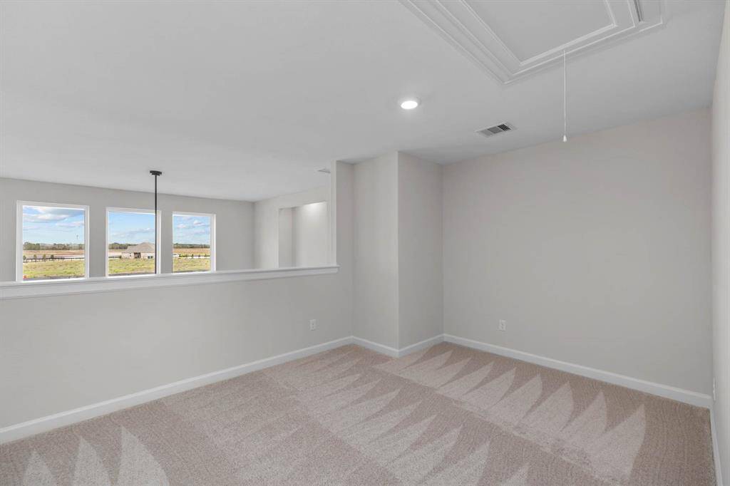 The upstairs gameroom / loft area offers additonal living spaces that can be used as a playroom, game room, or tv room.