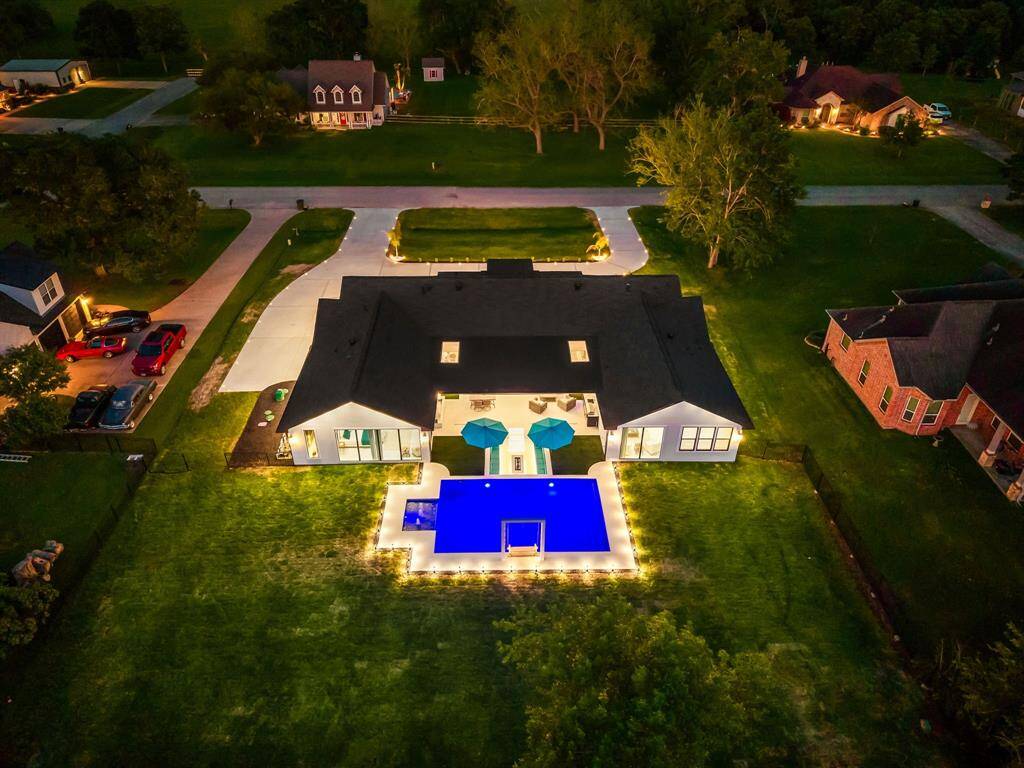 Welcome to your dream home in the prestigious Riverside Ranch! This stunning custom new construction sits on over half an acre and offers the perfect blend of modern elegance and serene waterfront living. Featuring seamless indoor/outdoor living, a sparkling pool, and high-end finishes throughout, this home is designed for both relaxation and entertaining. With clean lines, expansive windows, and a beautifully landscaped yard, every detail exudes luxury and comfort.