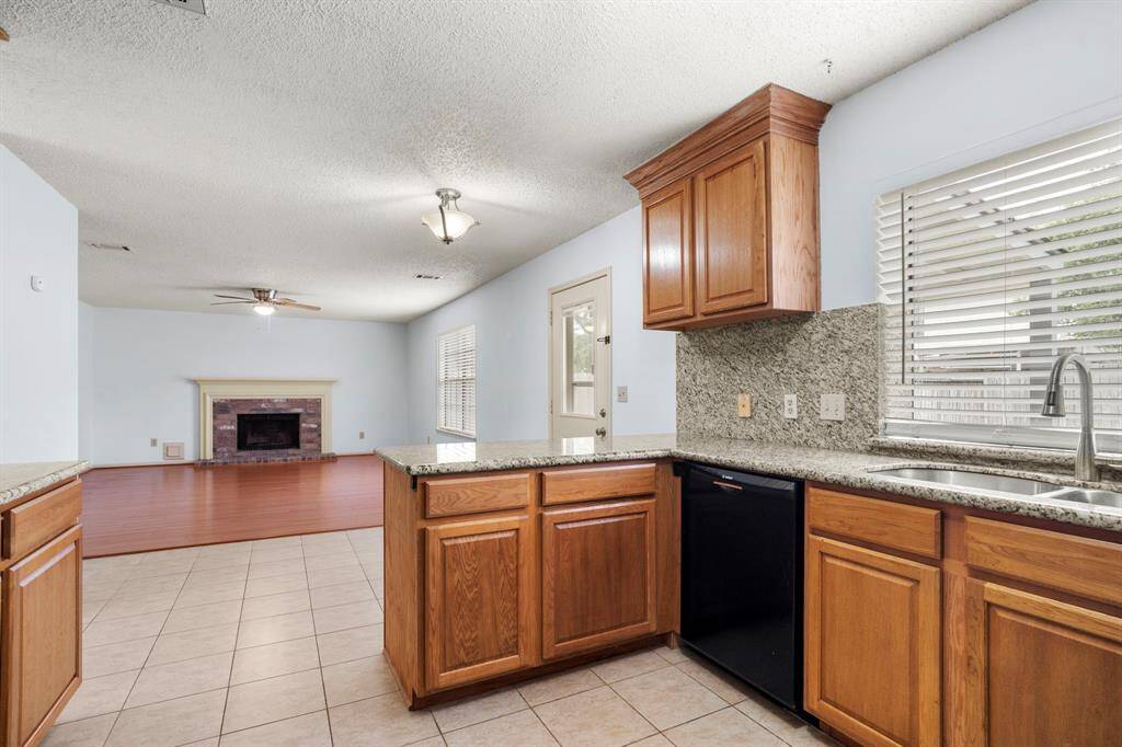 The kitchen opens to the family room, creating an inviting, open-concept space perfect for entertaining and everyday living.