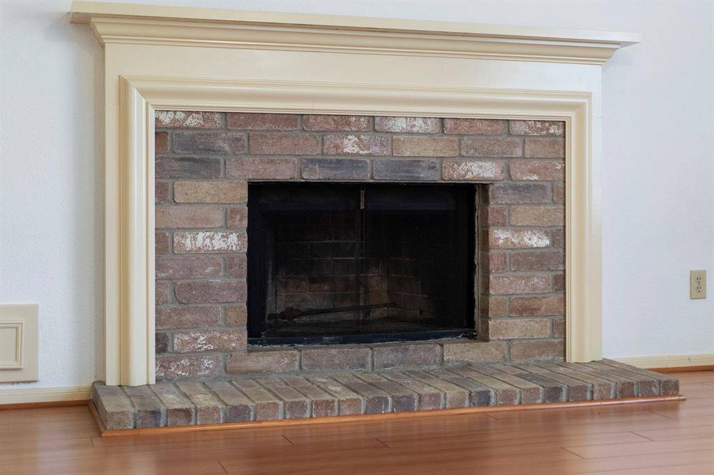 Enjoy the cozy brick fireplace during the cooler months.