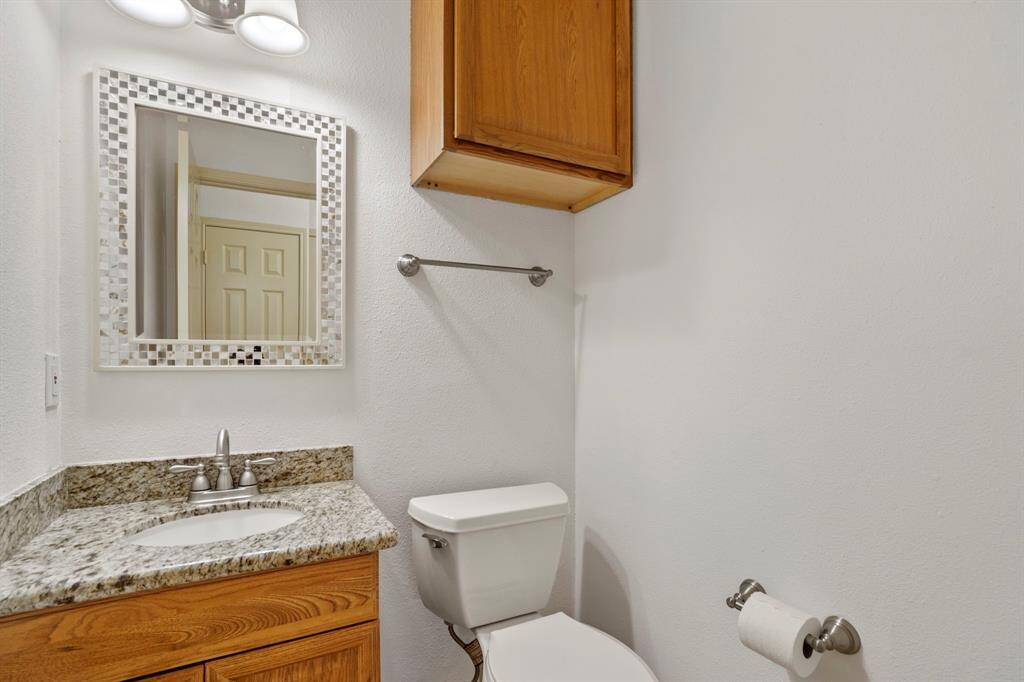 A centrally located first-floor guest half bath offers convenience and accessibility for visitors.