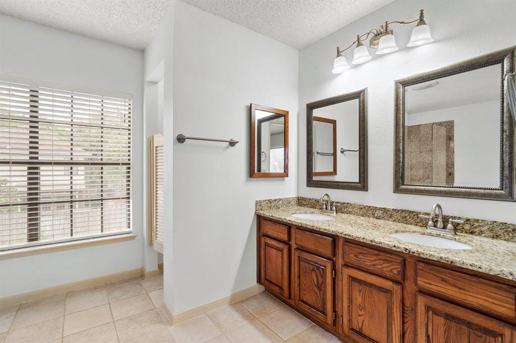 Plenty of room for two to get ready in the primary bathroom.