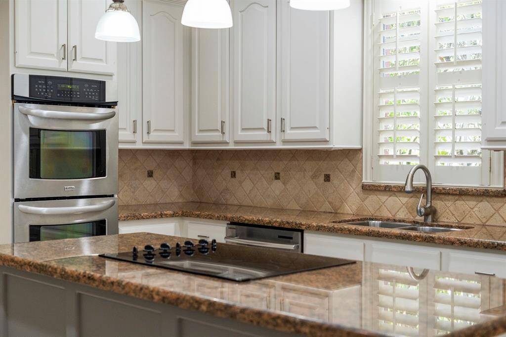 Beautiful granite countertops provide a durable and elegant work surface for preparing meals.