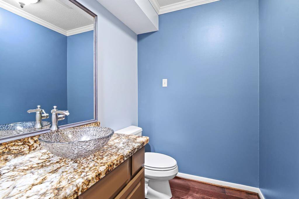 The first-floor guest bathroom is ideally situated near the main living areas, offering both convenience and privacy for visitors.