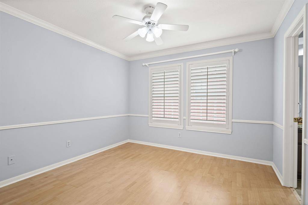A large window provides natural light in this secondary bedroom. The entire upstairs was freshly repainted in April 2025.