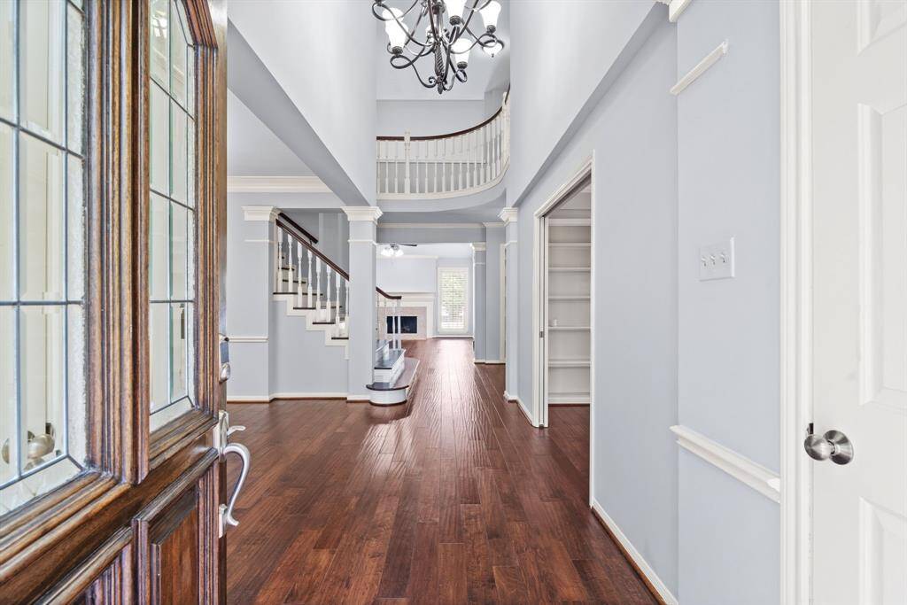 Step inside to discover a light-filled layout featuring a grand 2-story entrance.