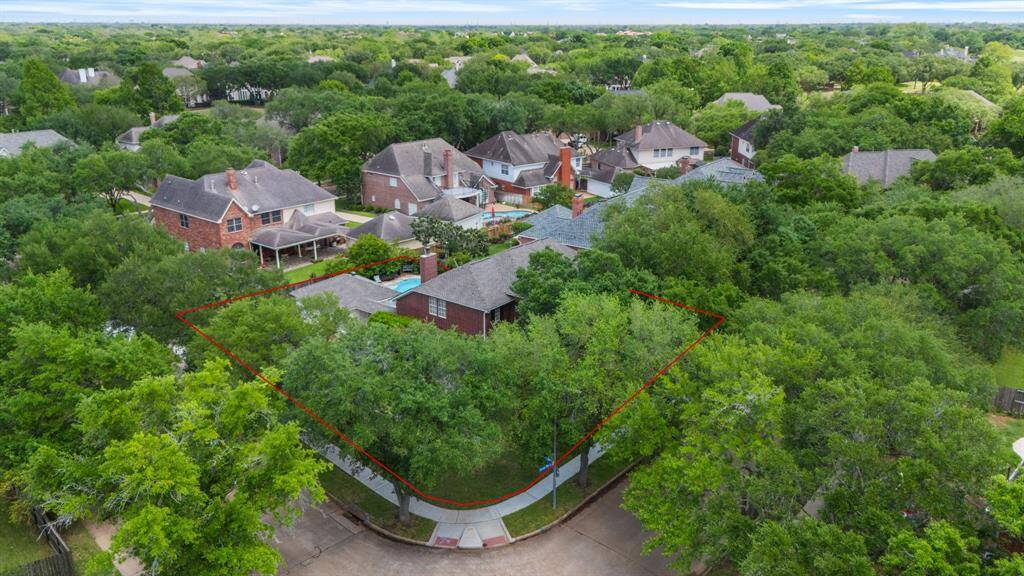 Mature trees surround the property, offering natural shade and added privacy. Best of all, the HOA maintains all the trees along the roadside for a well-kept, worry-free landscape.