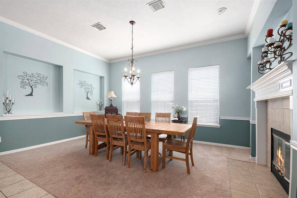 Formal dining room with two-sided fireplace