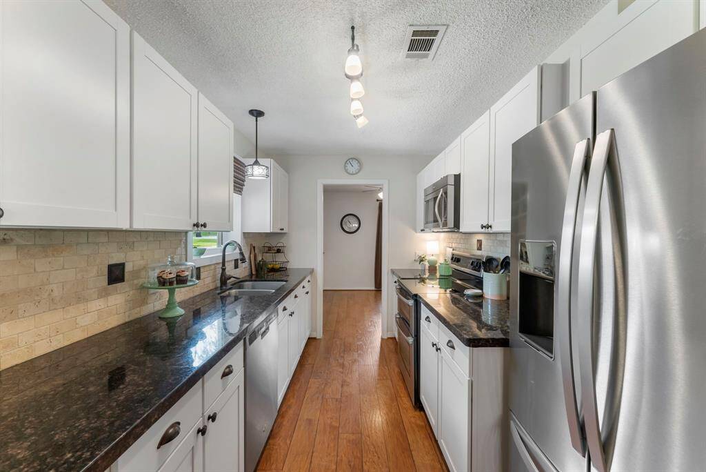 The kitchen offers a substantial amount of countertop space for prep work.
