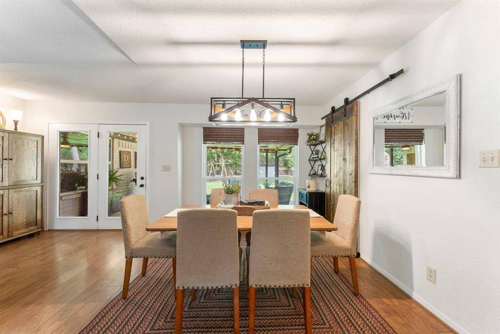 The configuration of the dining room affords sufficient space for a large dining table and extra seating.