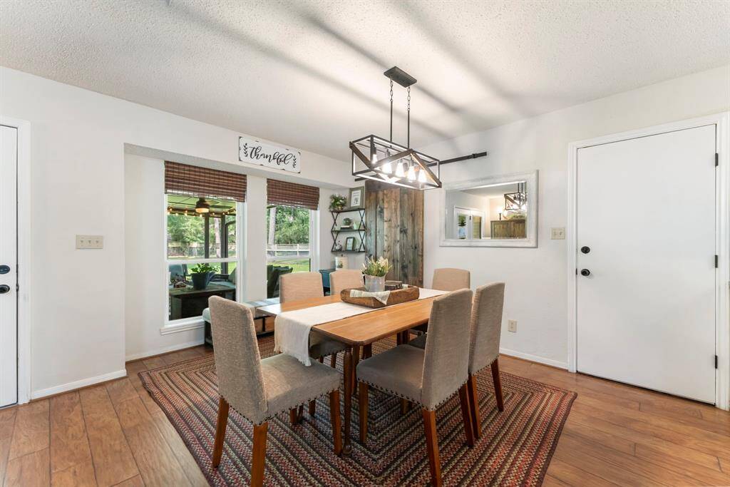 The dining room has views of the patio and huge backyard.