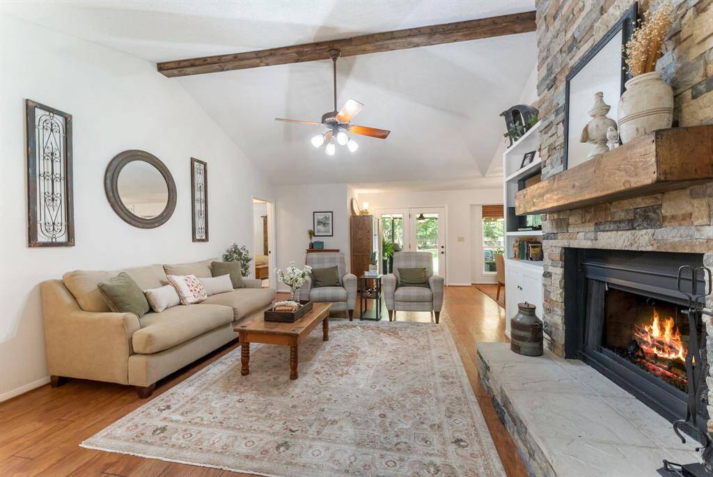 The wood beam adds architectural interest to the vaulted ceiling.