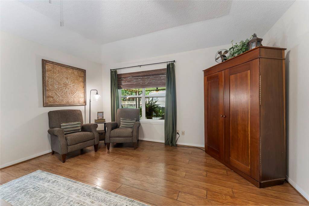 This massive bedroom has the capacity for a sitting area to read or watch TV.