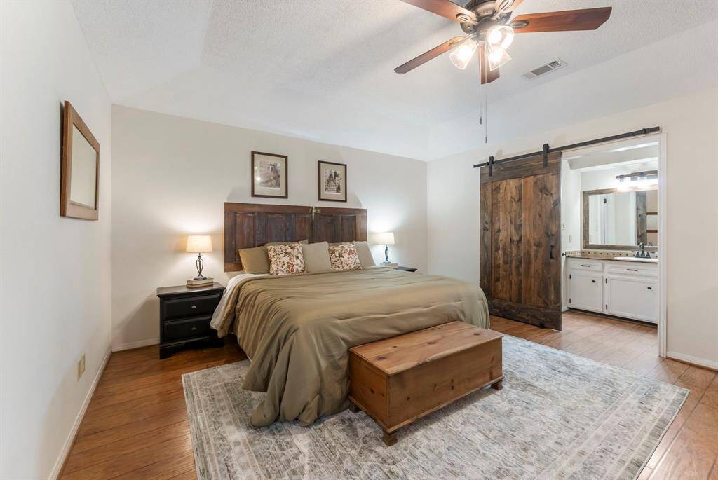 The barn door closes for privacy in the bathroom area and closet.
