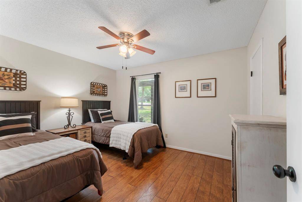 The first of two secondary bedrooms with a walk-in closet.