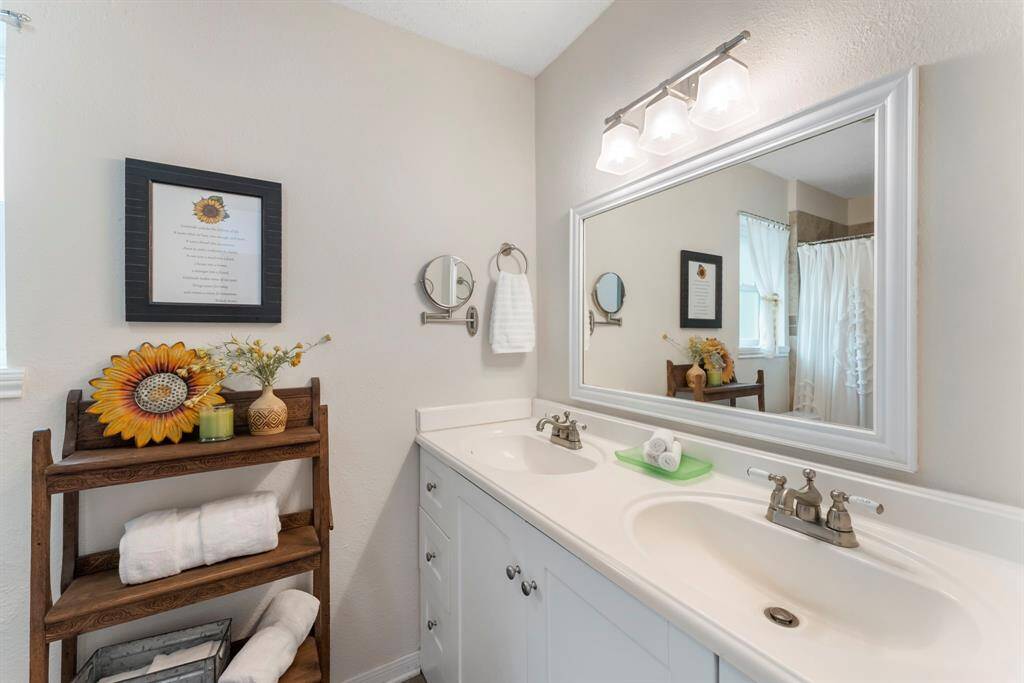 The secondary bathroom is nestled between the two secondary bedrooms.