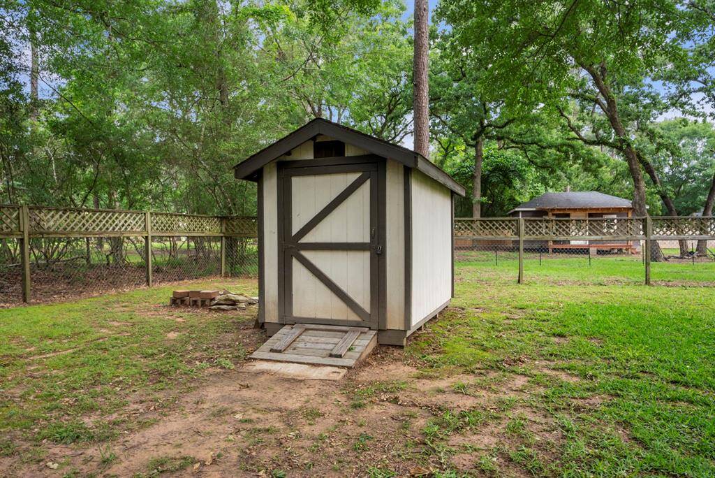 This storage shed can house additional tools or yard equipment.