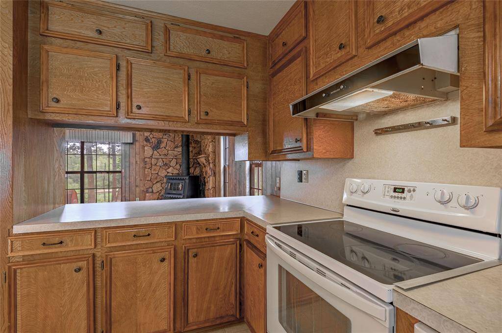 Kitchen with bar that opens into the living room