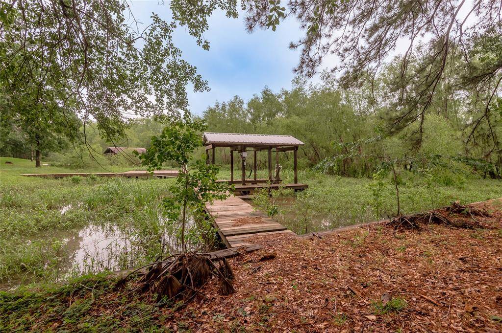 Backyard with pier and covered boat slip