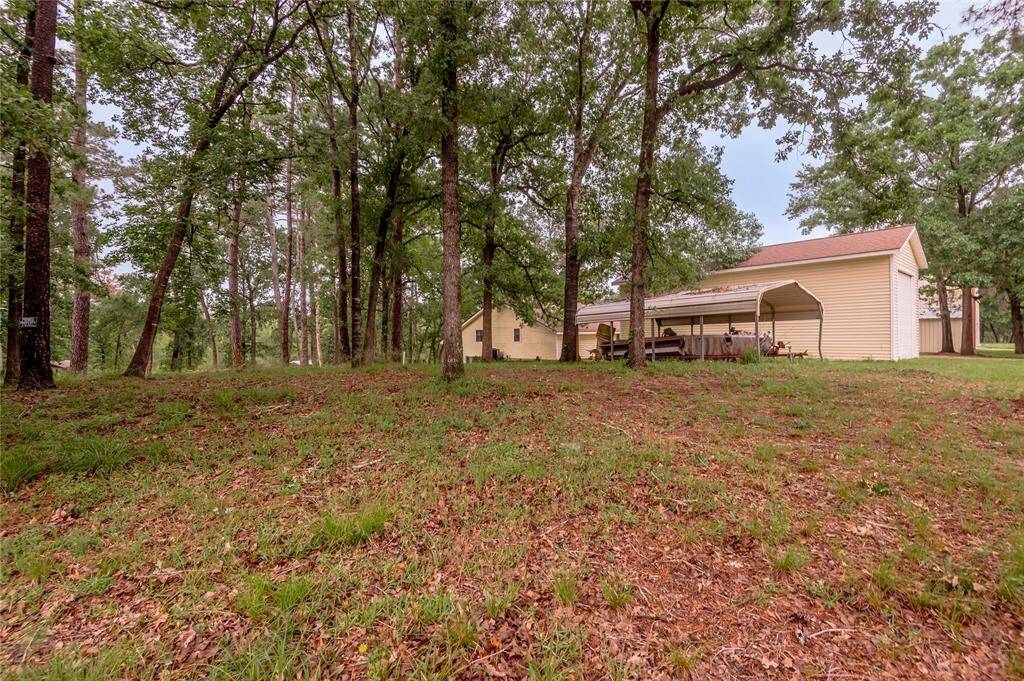 Side of the home with the second carport
