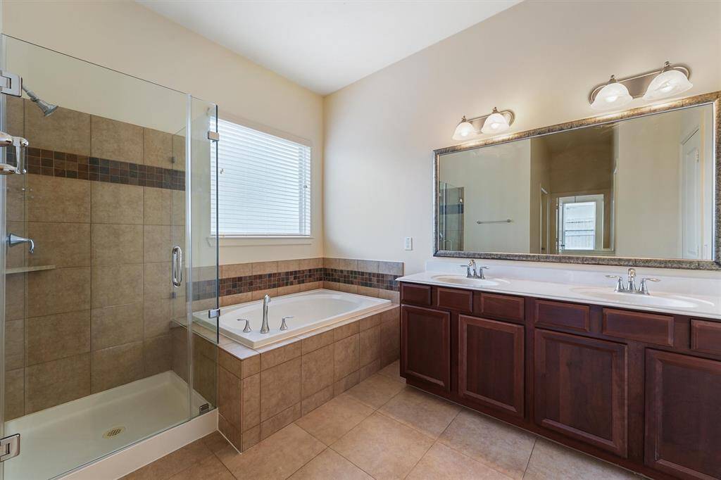 Master Bath with updated frameless shower.