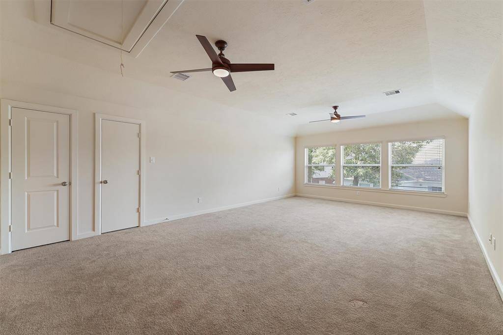HUGE game room upstairs with attic entry, closet and half bath.