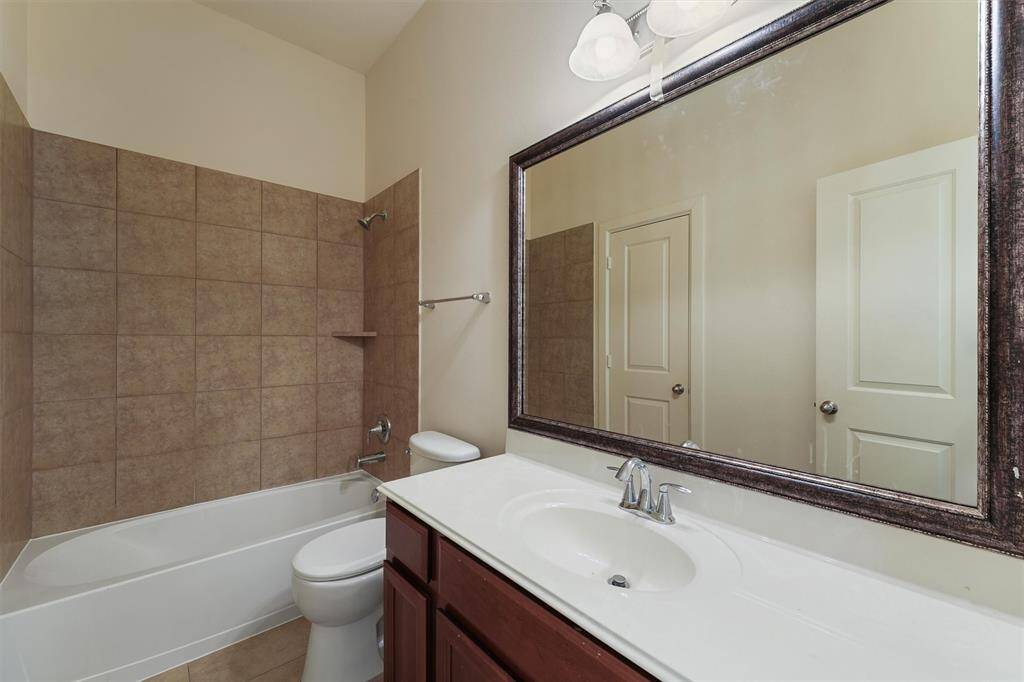 Secondary bathroom situated between bedrooms and flex space.
