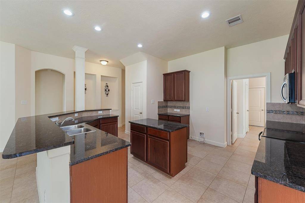 Kitchen opens into family room for great entertainment space.