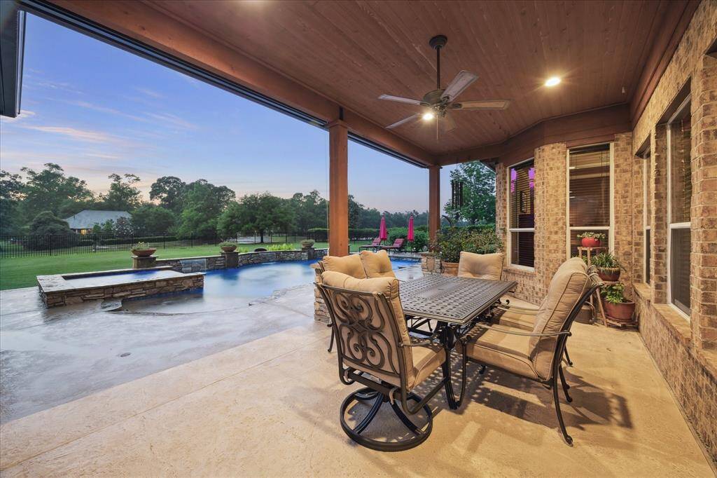 Enjoy outdoor dining under the adjacent patio with a manual sunshade, all overlooking the lush backyard and open greenspace. Additional upgrades include a 22kW Generac generator and a built-in organic pest control system—blending luxury, function, and peace of mind.