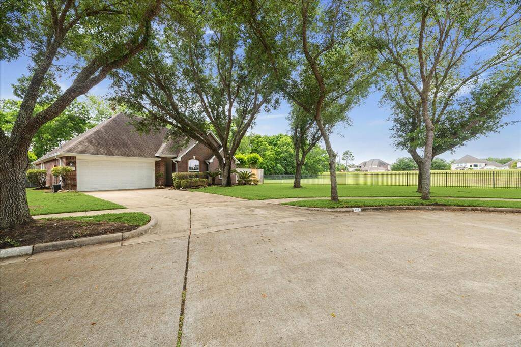 Tucked away at the end of a peaceful cul-de-sac on a picturesque, tree-lined street, this elegant one-story brick home boasts timeless charm and a generously sized driveway.