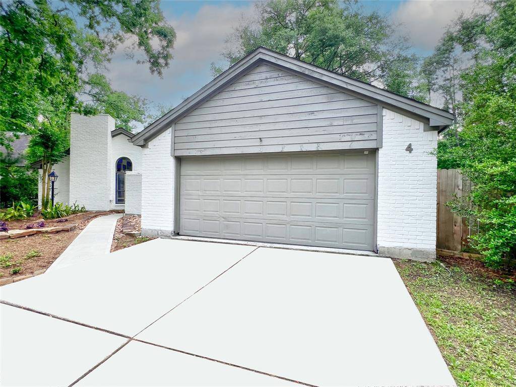 Two car garage with work area.