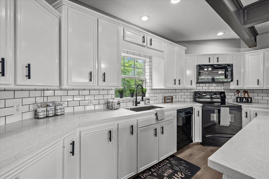 Updated kitchen with quartz countertops and subway backsplash