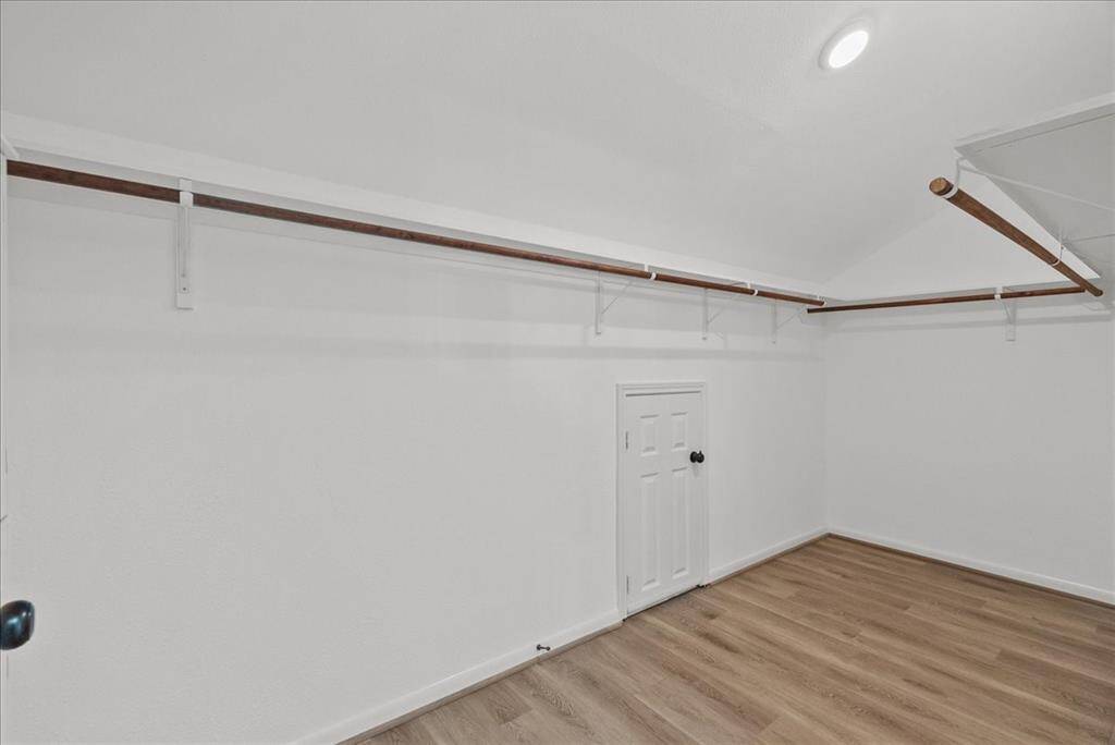 1 of 2 master closets with extra storage room
