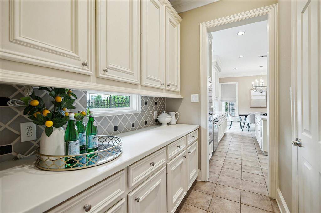 Enjoy this Butler's Pantry and all the space.