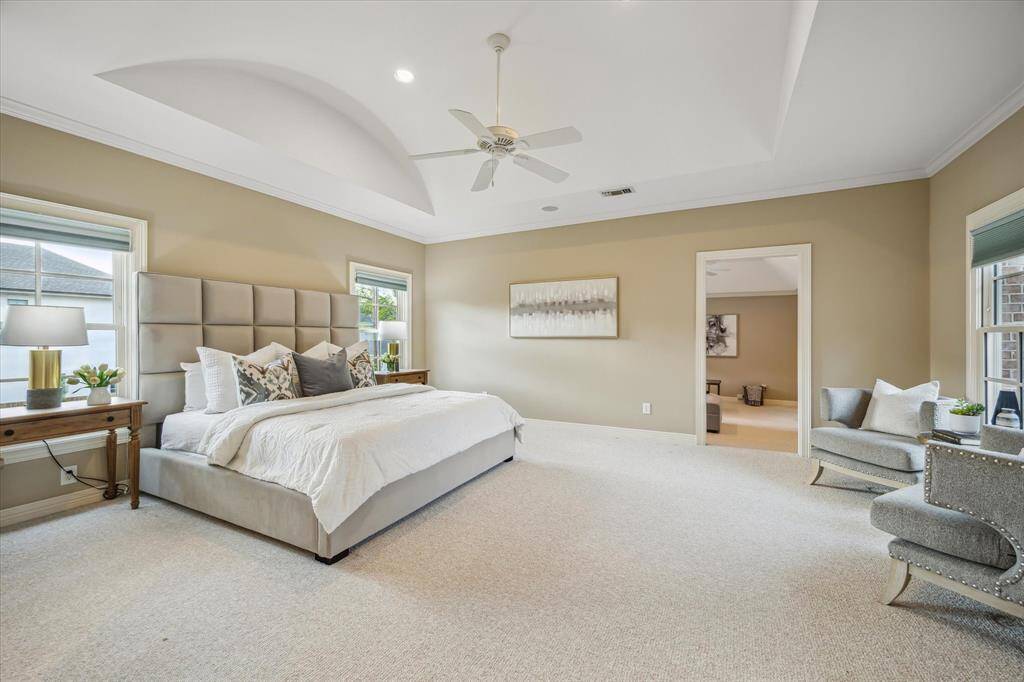 The Primary Bedroom (16' x 16') is amazing and offers a sitting area and spa bath, along with a fabulous gameroom/5th bedroom or bonus room off the Primary suite.