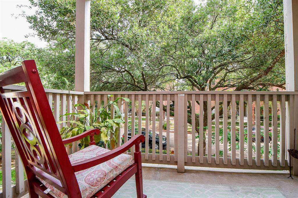 Relax and enjoy the great view from this balcony.