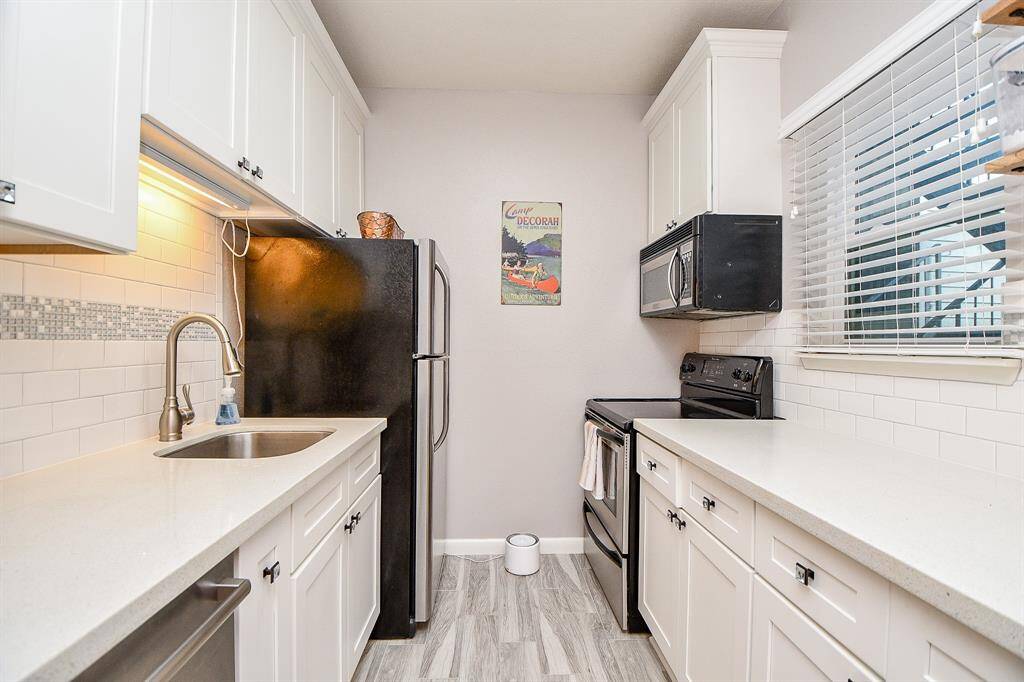 Light and bright kitchen with a window.