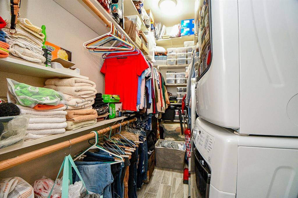 The bedroom closet is extra large and has space for the full size washer and dryer.