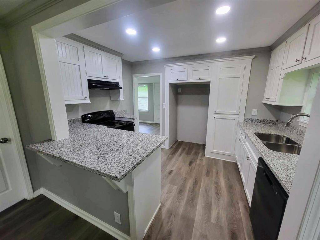 Fully updated kitchen with custom cabinets, granite countertops, recessed lighting, new appliances & more!