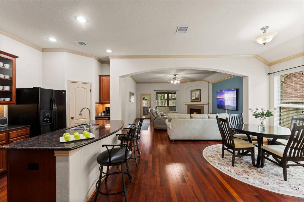 Expansive open-concept living area where the kitchen, dining, and family rooms flow together seamlessly.