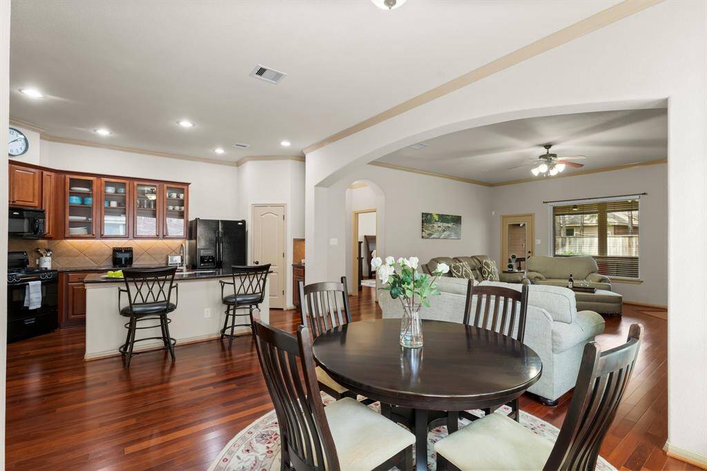 Sunny breakfast nook off the kitchen offers a cozy space to enjoy morning coffee and family meals.