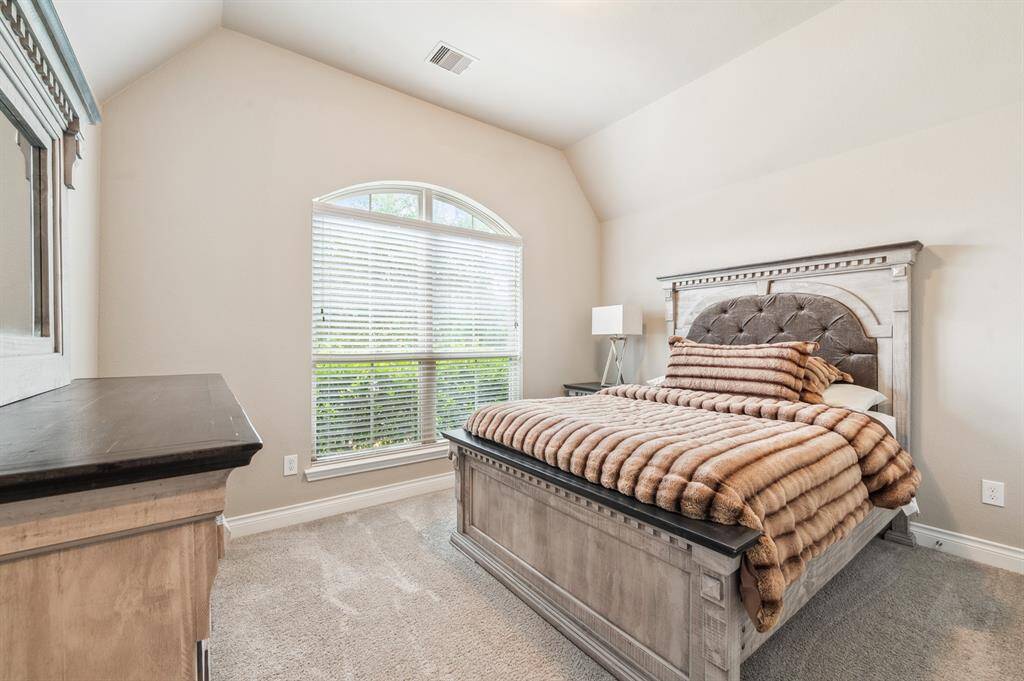 The three spacious secondary bedrooms offer ample natural light and versatile space for family or guests. They are conveniently served by two well-appointed bathrooms, ensuring both privacy and comfort.