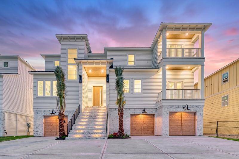 Luxurious waterfront estate featuring 7 bedrooms, 5 baths, and a 3-door garage accommodating up to 7 cars. Enjoy designer finishes, gold accents, and exquisite lighting throughout.