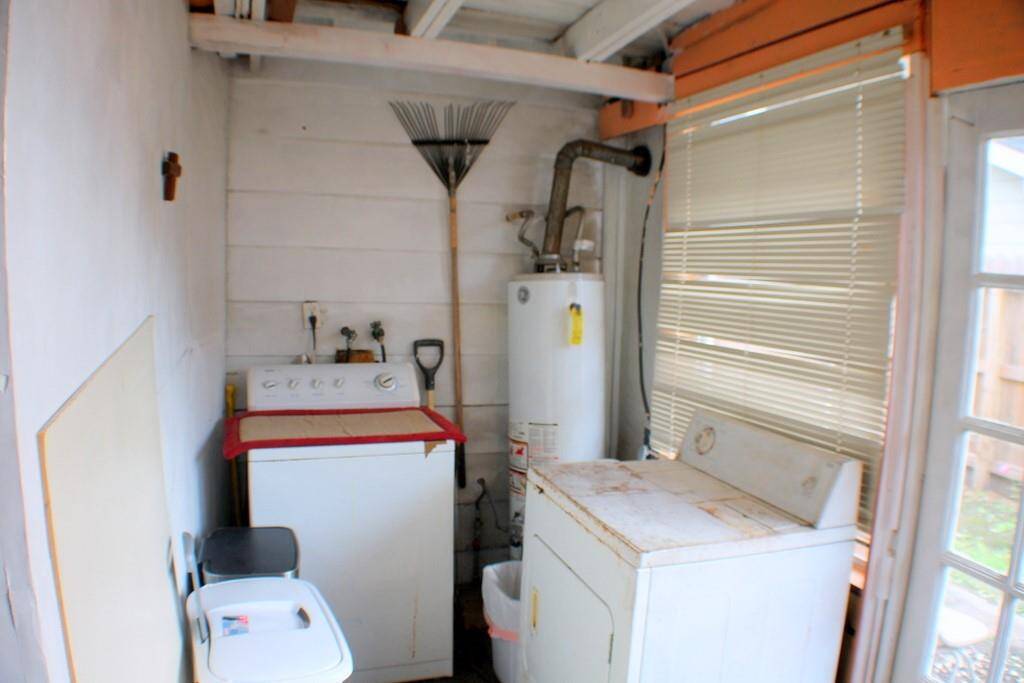 Laundry area in enclosed back room
