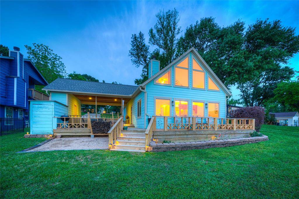 This home offers everything you are looking for in a lake home! Including the perfect spot to park your golf cart and ample deck space to enjoy!