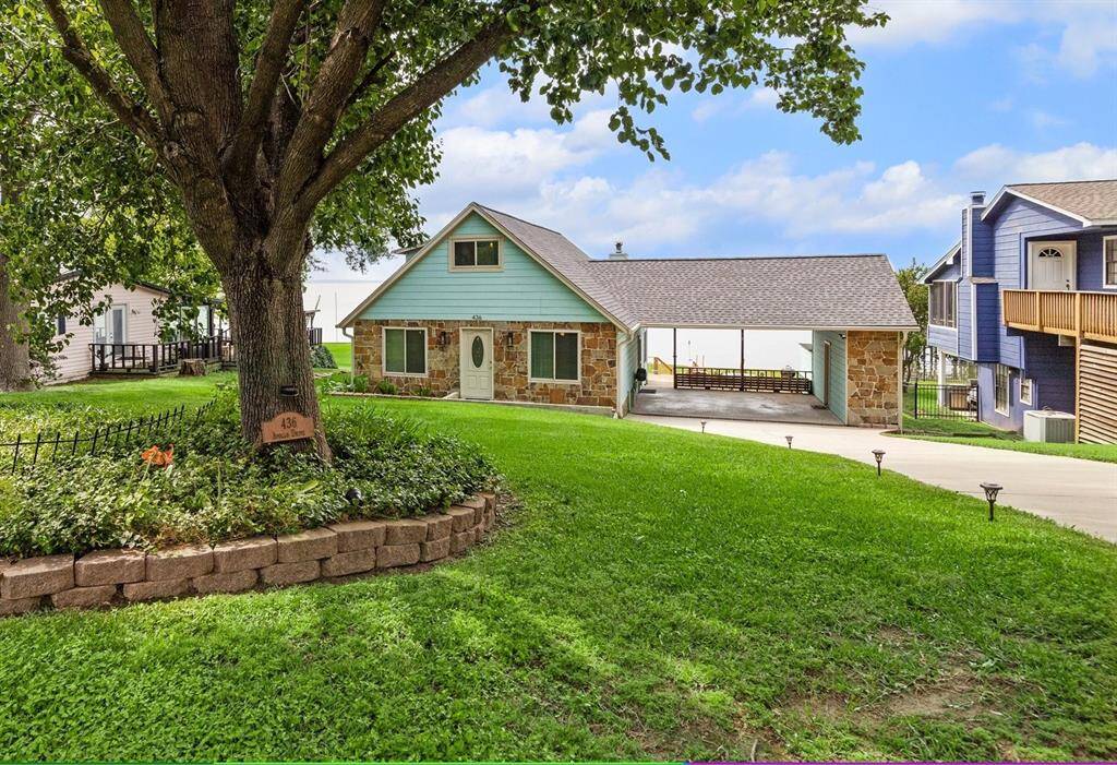 This home offers everything you are looking for in a lake home! Including the perfect spot to park your golf cart and ample deck space to enjoy!