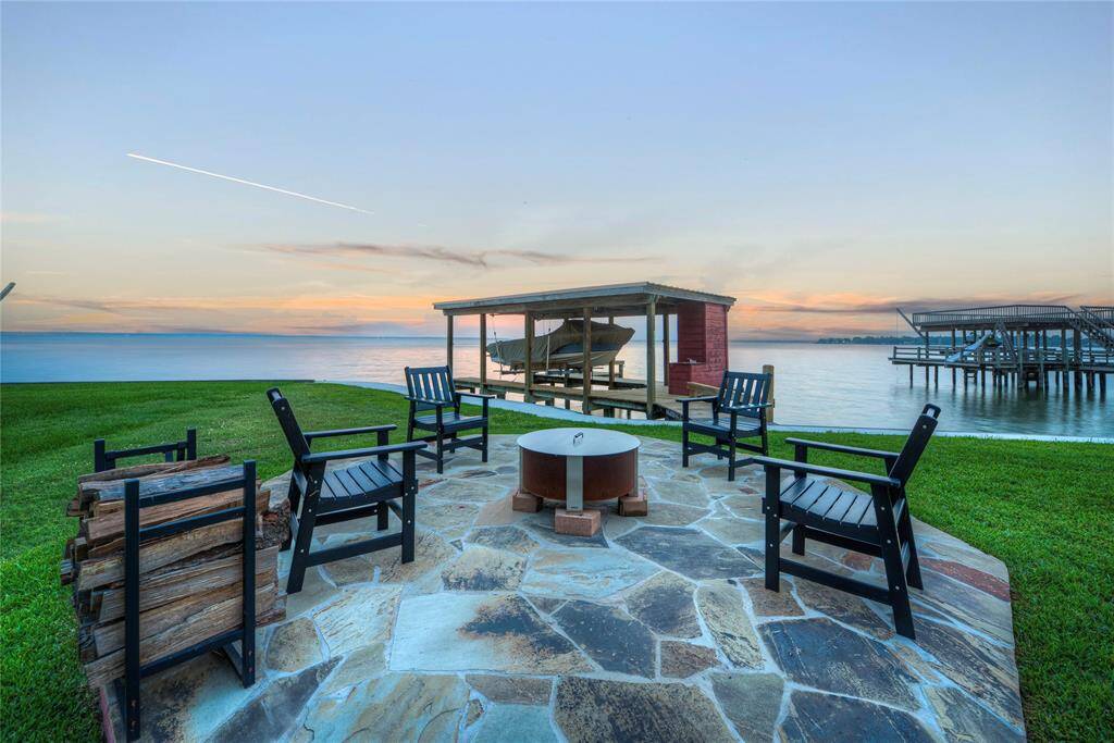 This home offers everything you are looking for in a lake home! Including the perfect spot to park your golf cart and ample deck space to enjoy!