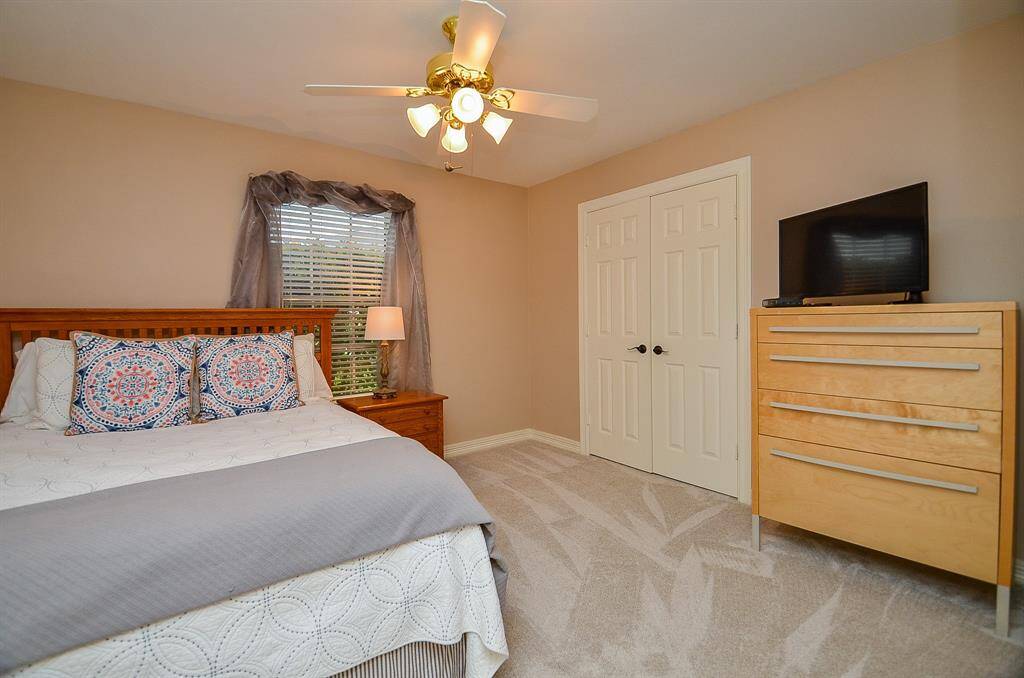 Another large carpeted secondary bedroom is perfect for family and/or visiting guests, with good closet space, too.